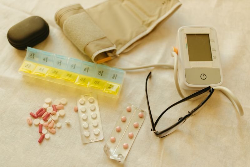 Blood pressure monitor on a pharmacy counter with medicines
